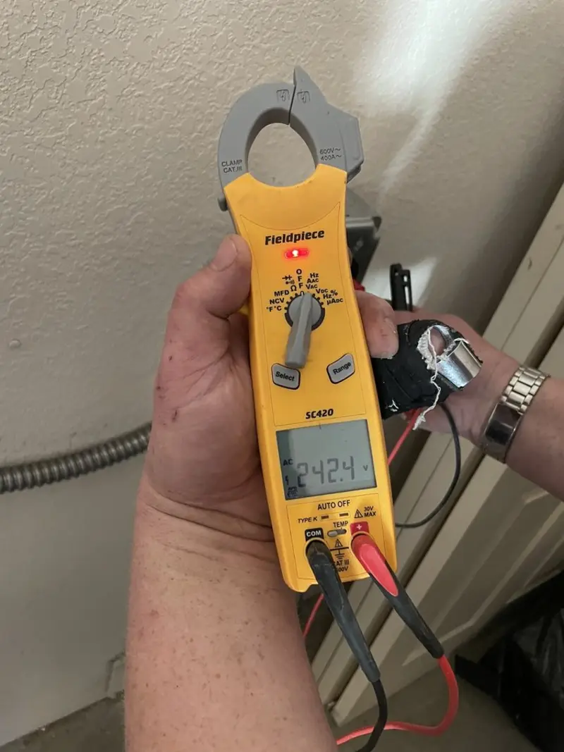 Voltage testing with clamp meter during Electrical Installation Services in Chelmsford